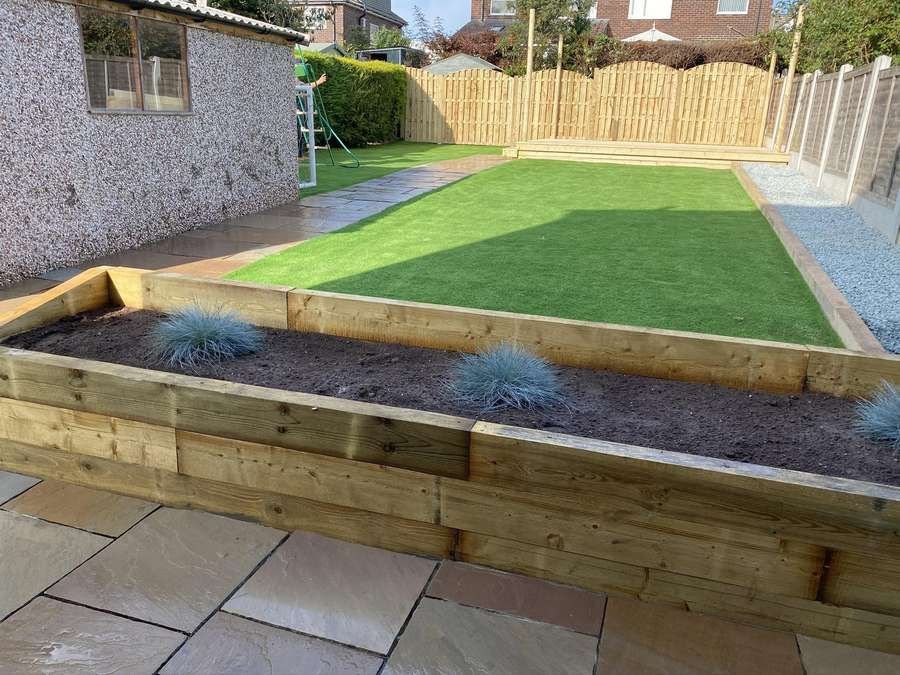 Landscaped garden with sleeper beds by MT Joinery
