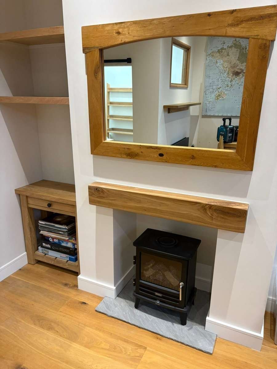 Oak fireplace surround by MT Joinery